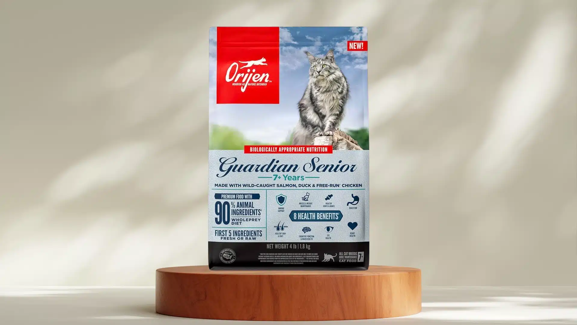 Orijen Guardian Senior cat food bag on wooden stand with long haired cat image and senior health support formula