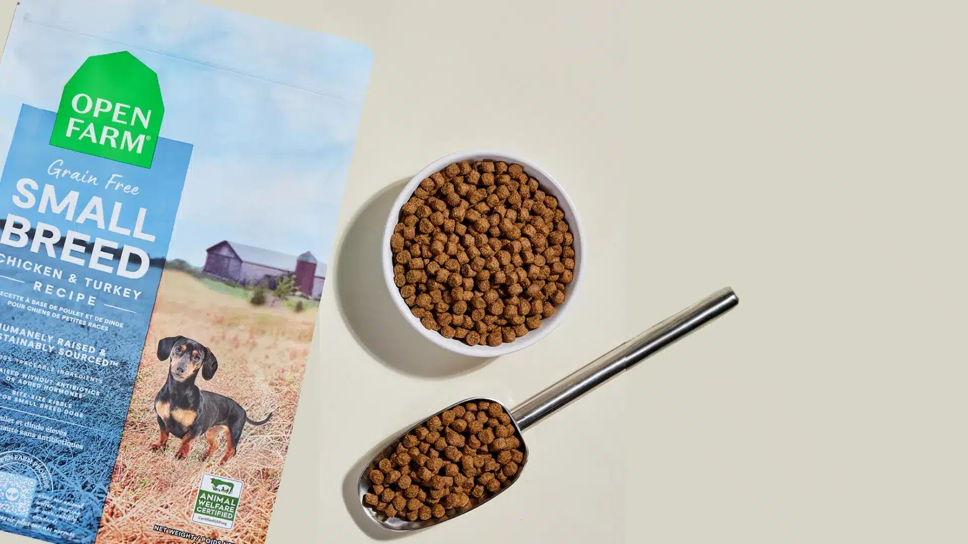 Open Farm small breed grain free chicken and turkey dog food bag with bowl of dry kibble
